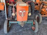 a tractor that is parked in a garage