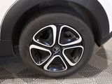 a close up view of a car ' s tire on the ground