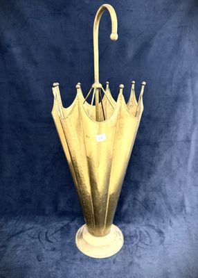 a gold umbrella that is sitting on a blue background