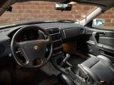 a car dashboard with a steering wheel and a dash board
