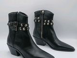 black leather ankle boots with studded straps and buckles