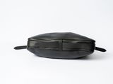 black leather toiletry bag on a white background