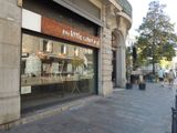 a store front with a sign on the side of the building
