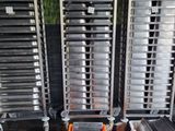 several trays of food sitting on top of a table next to each other