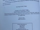 an open book with a picture of a cat on it