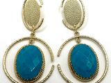 turquoise stone earrings with gold hoops on a white background
