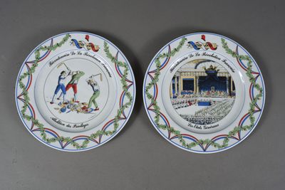 two plates with a picture of a man and a woman on them