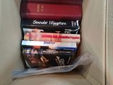a box full of dvds sitting on a couch