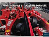 two books on a table with a picture of a race car