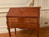 an old wooden desk with a drawer on top of it on a hard wood floor