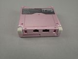 a pink device that is sitting on a table