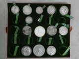a box of silver coins with ribbons around them