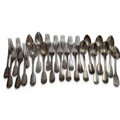 a lot of silver spoons and forks on a white surface