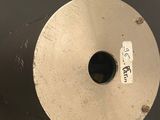 a close up of a toilet paper roll with a sticker on it