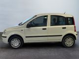 a picture of a small white car parked in a parking lot