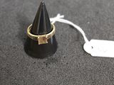 a close up of a ring with a tag attached to it