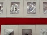 six different cell phones in the box on the red table