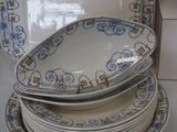 many plates stacked on top of each other on the counter