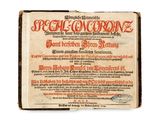 an old book with a red writing on the front of it