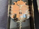 a bottle opener that is in a box on a table