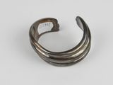a close up of a metal ring on a white surface