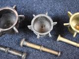 three different types of metal items on a blue carpet