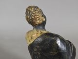 an image of a statue of a man with a hat on his head