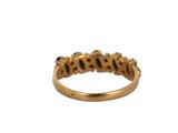 a close up of a gold ring on a white background