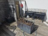 a potted plant on a deck with a hose