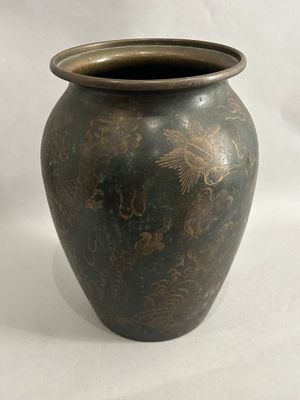a vase that is sitting on a white surface