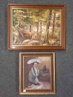two paintings of a woman and a deer are hanging on a wall