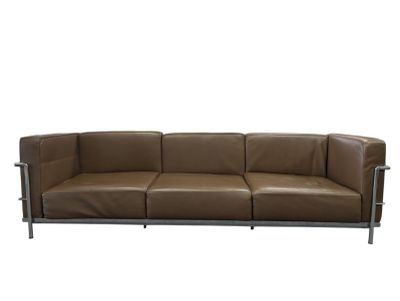 brown leather sofa with chrome legs and armrests on a white background
