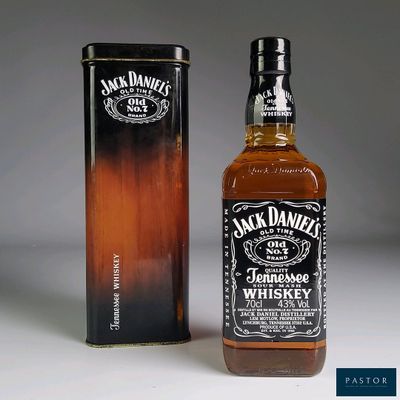 an image of a bottle of jack daniels whiskey next to a canister