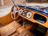 a brown leather car with a steering wheel and dashboard