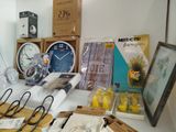 a table with many items on it and a clock on the table
