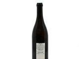 a bottle of wine that is sitting on a table