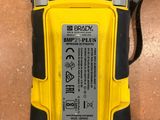 a close up of a yellow and black device on a table