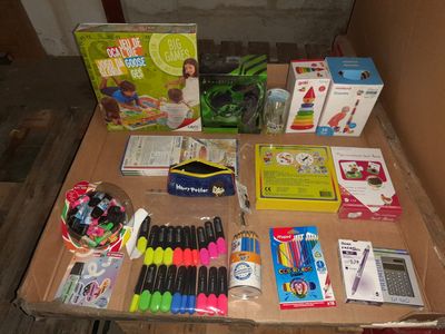 a table that has a lot of school supplies on it