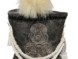 a black hat with a white feather on top of it