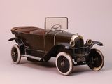a toy car that is sitting on a white surface