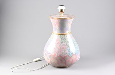 a lamp that is sitting on a table next to a lamp