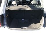the back of a car with the trunk open and the seats folded down