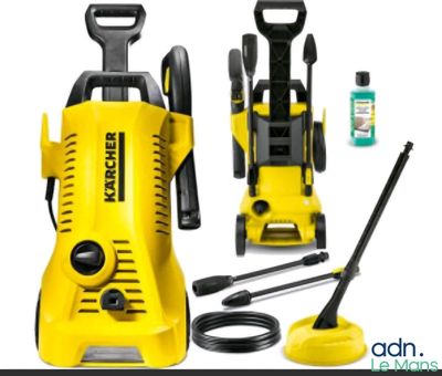 a yellow pressurer with a hose and other cleaning supplies