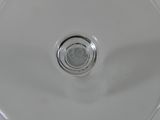 a close up view of a glass of wine on a table