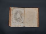 an open book with a drawing of a circle on it