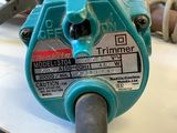a blue electric driller sitting on top of a table