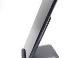 a cell phone on a stand on a white surface