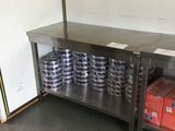 a large metal table with a bunch of cans on it