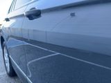 a close up of a car ' s door handle on the side of the car