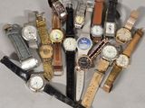 a lot of watches that are sitting together on a table